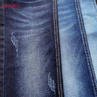 Tissu frais de denim de bout droit de jeans de femmes avec la couleur bleu-foncé de mèche claire de chaîne