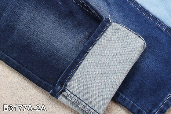 Les fausses couches de tricotage de tissu de sergé de denim de 9,5 onces doubles étirent le matériel de jeans