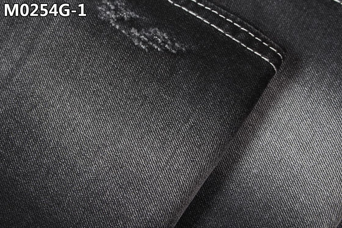 Le tissu de denim de Spandex de polyester de mèche de noir de 10,3 onces traitent à la légère Wear de bout droit de dames